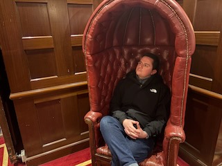 Grant sitting in a fancy chair